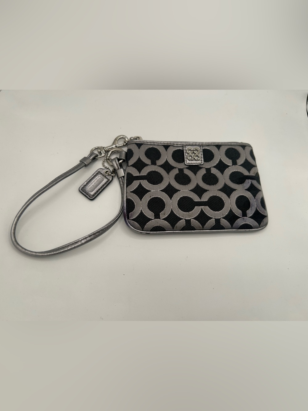 Coach Signature C Monogram canvas wristlet
